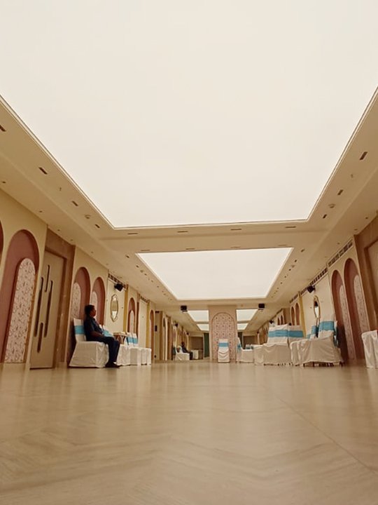 Printed stretch ceiling panel in a high-traffic mall atrium — durability and longevity benefits