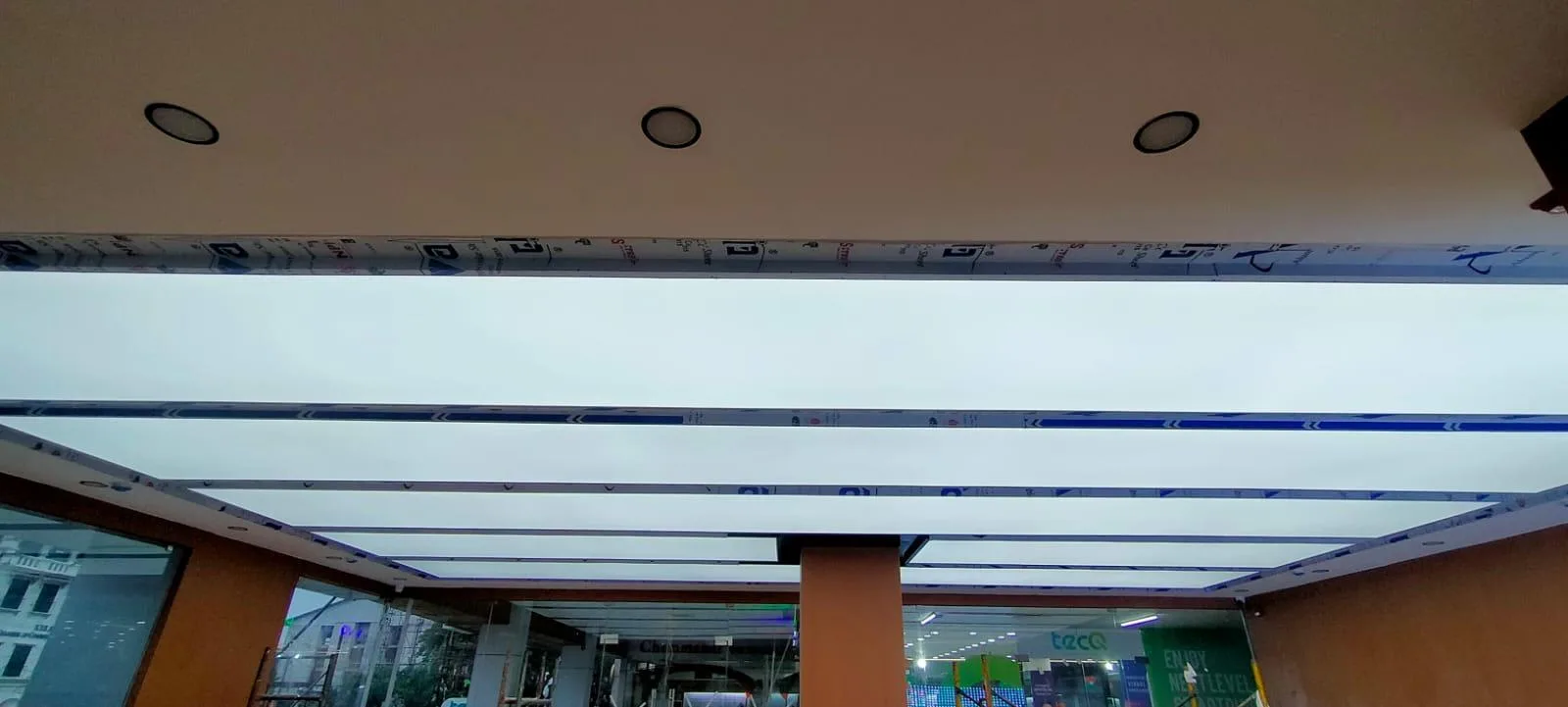 One Plus Showroom Translucent Grid Ceiling Kochi